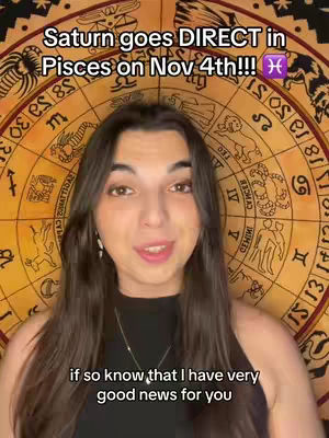 A woman with long brown hair and a black top is centered in the frame. Behind her is a circular astrological chart with various symbols and text in a warm yellow color. The text "Saturn goes DIRECT in Pisces on Nov 4th!!!" is overlaid in white at the top. The woman is smiling slightly, and the background suggests a focus on astrology.