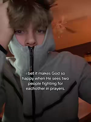 A young man in a grey hoodie is the main focus. He is looking directly at the camera with a somewhat somber expression. overlaid text is directly under him