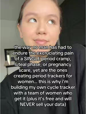 The cover image features a close-up shot of a woman looking slightly upwards, set against a softly lit interior background, possibly indoors. The woman, who appears to be the content creator, is fair-skinned with her brown hair pulled down, revealing what seems to be a light make-up base. The text overlay includes the creator's commentary and message about period trackers, which is displayed in a readable, sans-serif font, with the words in a bold font.