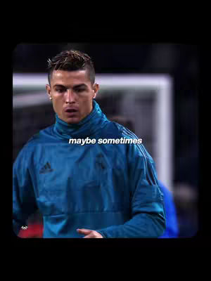 The image features a medium close-up of Cristiano Ronaldo. He is wearing a blue Adidas training jacket with the Adidas logo and the Real Madrid crest on the left. The background has a blurred view of the pitch and stadium lights. The text overlayed on the image says 'maybe sometimes'.
