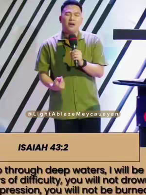 The image shows a man speaking in front of a black and white striped backdrop. He wears a green button-down shirt and holds a microphone. Below him is a tan banner with text, and the handle @LightAblazeMeycauayan is also included. The overall composition centers on the man with a focus on the message.