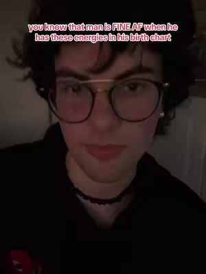 The cover image is a selfie of a person with dark hair, wearing round glasses, and a black top. The person has a slightly raised left eyebrow and is looking directly at the camera. There is text overlaid at the top of the image.
