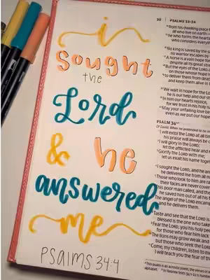 A colorful page from a Bible journal with handwritten text in various colors. The text reads 'I sought the Lord & he answered me Psalms 34:4'. Markers are visible in the top left corner and parts of the scripture are visible on the right side.
