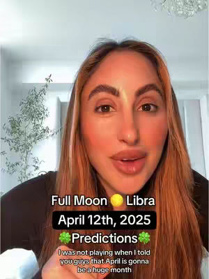 The cover image features a woman with long auburn hair facing the camera. Text overlays include details related to a Full Moon and astrological predictions, with a small circle symbolizing the sun or moon. The background is indistinct but appears to be a well-lit interior.