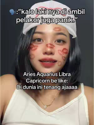 A young woman with dark hair and red lipstick kisses on her cheeks stands in front of a dark background. Text overlays indicate the zodiac theme of the video.