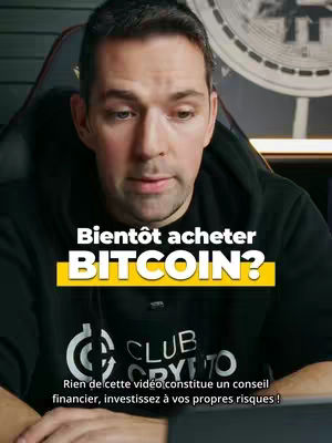 A man with short brown hair looks down towards the bottom of the frame. Text overlays read 'Bientôt acheter BITCOIN?' in a bold, white font within a yellow highlighted box. The man wears a black hooded sweatshirt with the 'Club Crypto' logo. The video contains additional text at the bottom warning that it is not financial advice.