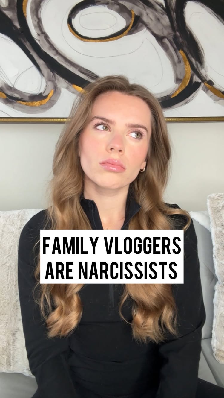 The cover image features a woman with long, wavy blonde hair, seated on a couch in what appears to be a domestic setting. She is looking off to the side with a slight frown, and the text overlay reads "FAMILY VLOGGERS ARE NARCISSISTS" in bold, white text against a black rectangle. The background is blurred, showing abstract wall decor.