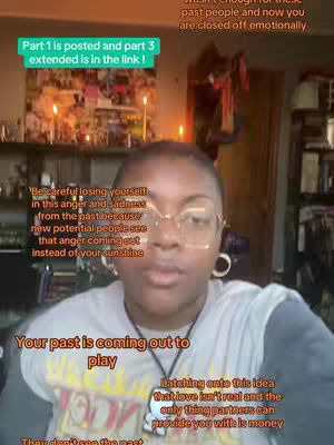 A woman with short hair and glasses is centered in the frame, speaking directly to the viewer. The background is a dimly lit room with a cluttered shelf and a wall covered in photos and decorations. Text is overlaid on the image, adding to the content's message.
