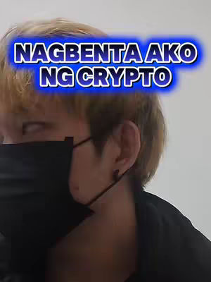 The cover image features a close-up shot of a person wearing a black face mask. The person has light-colored hair and is facing the camera. A blue text overlay reads "NAGBENTA AKO NG CRYPTO". The background is a plain, light color.