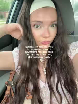 A woman with long brown hair and a white headband in a car. Text overlay on the image.