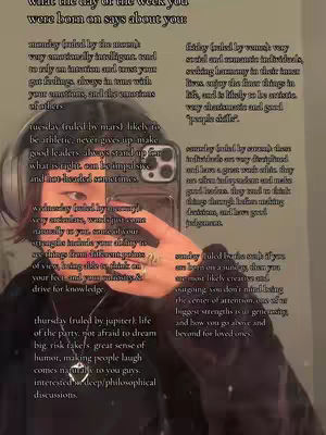 The image is a selfie-style shot featuring a person holding a phone, likely taking a picture. The background includes text that appears to be a list or a description, possibly related to astrology or zodiac signs. The person's face is partially visible, and the image is well-lit, suggesting a casual setting.