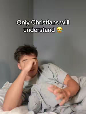 A young man lies on a bed, partially covered by a blanket, with his hand covering his eyes. Above him, text reads 'Only Christians will understand,' accompanied by a laughing emoji.