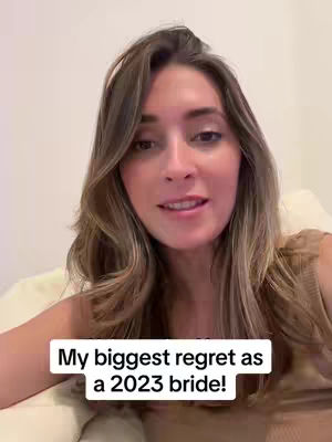 A woman with long brown hair sits in front of a neutral background, looking towards the viewer, and a white rectangular text box at the bottom reads "My biggest regret as a 2023 bride!"