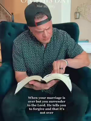 A man in a dark green button-down shirt and black baseball cap sits in a teal armchair, reading a book. Text overlays the image.