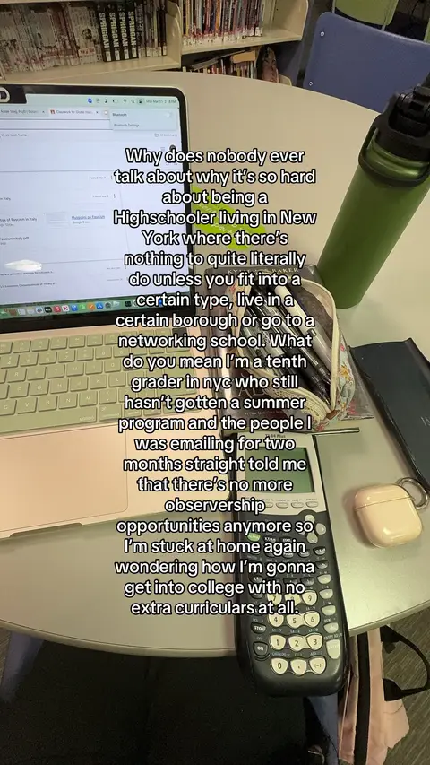 The cover image shows a laptop open on a table next to a water bottle, a pencil case, and a calculator. Text is overlaid on the image discussing the challenges of being a high schooler in New York who feels stuck. The setting appears to be a library or study area.