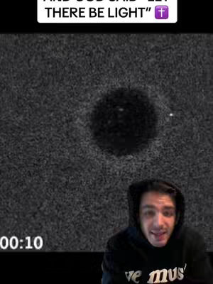 The cover photo features a zoomed-in shot of a man in a black hoodie, looking towards the camera. Behind him, there's an abstract background with a dark, possibly cosmic, texture. Above him, text reading "AND GOD SAID - LET THERE BE LIGHT" is displayed. The overall composition is simple, focusing on the man and the text.