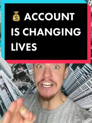 The cover image features a man with an excited expression in front of a cityscape background. Overlayed on top is a black rectangle with white text that reads '$ ACCOUNT IS CHANGING LIVES'. The background is a blurred view of tall buildings, creating the impression of a cityscape.