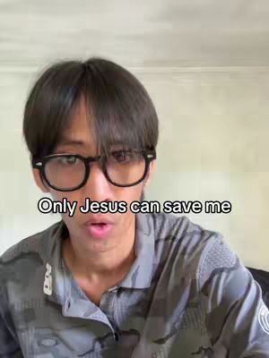 A young man with dark hair and glasses is positioned in front of a plain backdrop. The text overlay, "Only Jesus can save me," is displayed prominently at the bottom of the image.