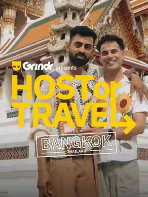 The image shows two men posing in front of a golden-colored building with ornate architecture. The men, one with a beard and the other smiling, are the focus, with overlaid text promoting a travel series about Bangkok.