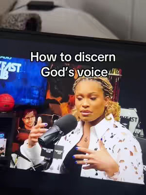 The cover image shows a woman on a television screen. Text overlaid on the screen says, "How to discern God's voice". The woman is wearing a white, patterned top and looks to be speaking into a microphone. Behind her, the backdrop of the set includes a red basketball, and images and logos of the "Breakfast Club" broadcast. The overall tone is serious, related to religious teachings.