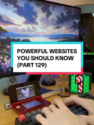 A cover image showing a person's hands on a keyboard with a computer screen in the background, displaying text on a colored rectangle. The background features a large screen with a landscape scene. A Nintendo DS is on the desk as well.