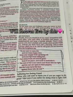 A close-up shot of an open Bible with highlighted text. Overlayed text in a handwritten style reads "Will forever live by this" near the top with a pink heart emoji, with the text partially obscuring the religious text.