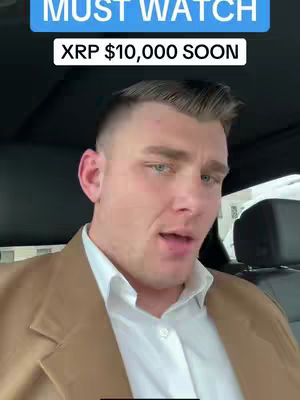 A man inside a car looks toward the camera, overlaid with the text "MUST WATCH" and "XRP $10,000 SOON". The background is blurred, with car interior visible.