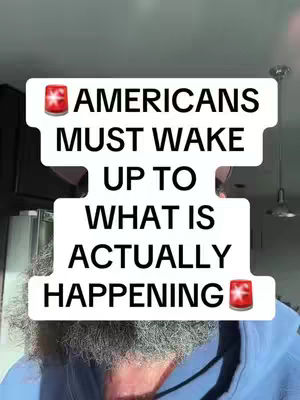 A man's face with a gray beard is partially visible at the bottom, and there are white rectangular text boxes containing the message: 'AMERICANS MUST WAKE UP TO WHAT IS ACTUALLY HAPPENING'. Siren emojis are included at the top and bottom of the text boxes.