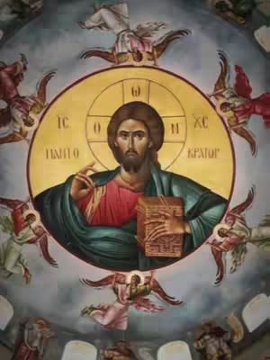 A painting depicting Jesus Christ surrounded by angels. Jesus is in the center, holding a book and gesturing with one hand, within a golden halo.  The background is an ornate, sky-blue with the angels. The overall tone is religious and artistic.