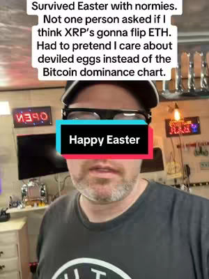 A man with glasses and a hat is in a room, and a blue and red bar that says "Happy Easter" is over his mouth. There is text above the bar that says, "Survived Easter with normies. Not one person asked if I think XRP's gonna flip ETH. Had to pretend I care about deviled eggs instead of the Bitcoin dominance chart."