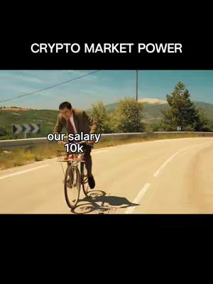 The cover image features a meme. The main image is a scene from a movie, depicting a man riding a bicycle on a road. The scene is set outdoors with a sunny sky. Text overlays include "CRYPTO MARKET POWER" at the top and "our salary 10k" on a white background near the bottom.