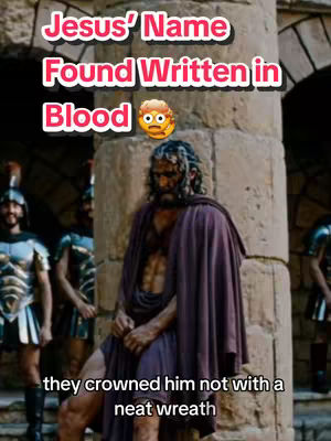 The image shows a scene from a film depicting Jesus, with text overlays. Jesus is the central figure, standing with a sorrowful expression. He is wearing a maroon robe and has a crown of thorns. Other men in Roman armor are standing in the background. The text overlay reads, 'Jesus' Name Found Written in Blood,' which is in a pink rounded rectangle and is surrounded by other text.