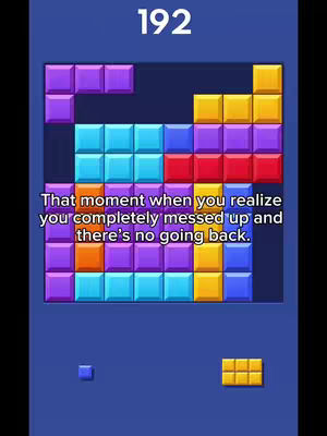 A screenshot of a tetris-like game in progress, filled with colorful blocks, with a text overlay that has a humorous caption.
