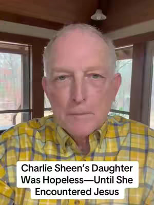 An older man with short, grey hair and a plaid shirt is centered in the frame. Text overlayed at the bottom reads 'Charlie Sheen's Daughter Was Hopeless—Until She Encountered Jesus'. The background includes windows and a simple light fixture.