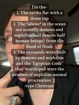 A medium shot of a woman with glasses, pointing towards text overlaid on the image describing various beliefs about the earth, aliens, and ancient structures. The text is arranged in a list format.