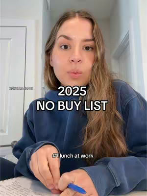 A woman with long, light brown hair is centered in the frame. She's wearing a blue hoodie and looking slightly towards the camera with a neutral expression. Overlaid on the image is a bold text that reads "2025 NO BUY LIST". Beneath this is a smaller text line that starts with "#1 lunch at work". The background is a slightly blurred interior scene, possibly a home or office.