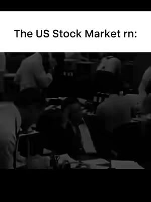 A black and white cover image captures a trading floor filled with many people in suits, some are standing, and most are sitting and working at desks. The image focuses on the activity and the intensity of the trading environment.
