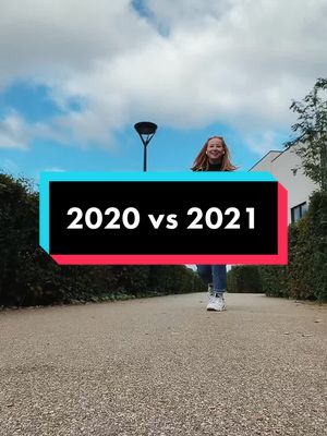 A woman is walking towards the camera on a path, with a blue sky and clouds in the background. Overlayed is a rectangular graphic with the text '2020 vs 2021'.