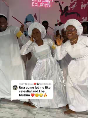 A group of people dressed in white robes and head coverings are in a bright room. Some are smiling and looking at the camera, others are turned away. A comment box with text is overlaid in the lower part of the image.