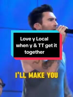 A man singing into a microphone, with text overlays. The image is a medium shot of the man in front of a blue background.