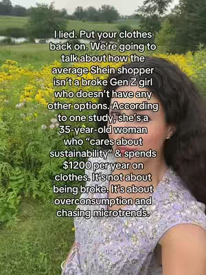 A woman with dark hair is centered in the frame, looking towards the camera. She is wearing a lilac top with a floral pattern. The background is a vibrant field of yellow flowers in a natural setting.