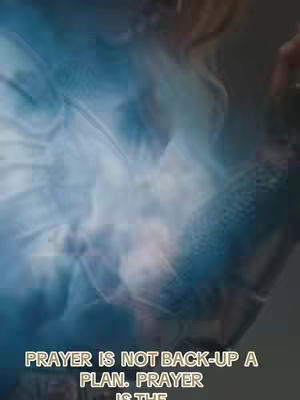 The cover image has a blurred, abstract background primarily in shades of blue and white, resembling clouds or wisps of energy. Overlaid on this is text in a gold-yellow font that reads, 'PRAYER IS NOT BACK-UP A PLAN. PRAYER IS THE'. The text is positioned towards the bottom, while the rest of the space is covered by the abstract illustration.
