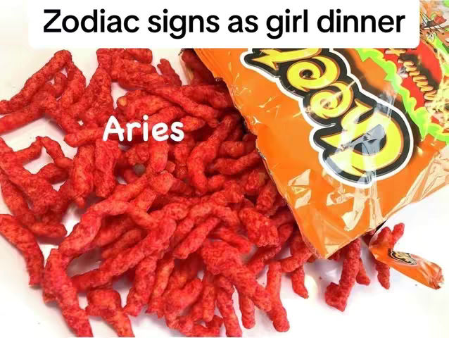 The cover image shows a white surface covered in red, fried, and curled snacks. A bag of Cheetos, is on the right, open and spilling out some snacks. The word "Aries" in white text is overlaid on the red snack.