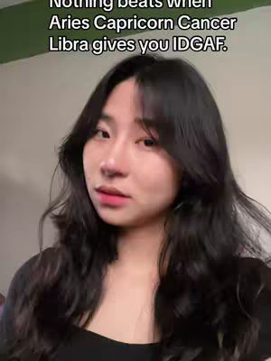 A young woman with long, dark hair looks towards the camera with a slight expression. Text overlaying the image presents a quote about zodiac signs.