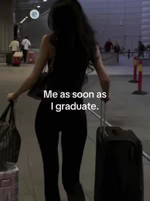 A woman walking through a brightly lit airport terminal, pulling a suitcase and carrying a bag, with a text overlay.