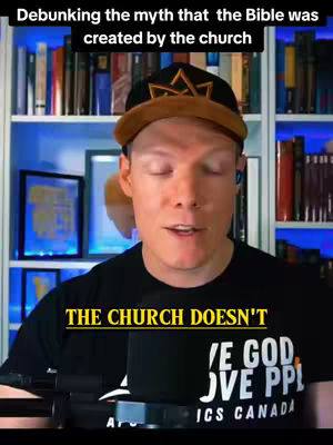 A man in a black t-shirt and a baseball cap is in front of a bookshelf, with text overlaid at the top and bottom.