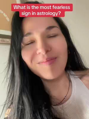 A woman with long black hair and a white tank top is shown in a close-up shot. She has her eyes closed and a slight smile. Overlayed on the image is a red banner displaying white text.