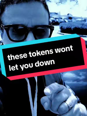 A selfie-style cover image with a man in black-rimmed sunglasses looking towards the viewer. The background appears blurred, suggesting an outdoor setting. Overlaid on the image is a black rectangle with text in white that reads 'these tokens wont let you down'. The man is pointing his finger towards the viewer with a ring on one of his fingers.