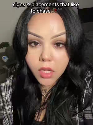 The cover image is a close-up selfie of a person with dark hair and fair skin. Above the person's head is text that says 'signs & placements that like to chase'. The person in the image is looking directly at the camera with a neutral expression. The background is out of focus and appears to be a room.