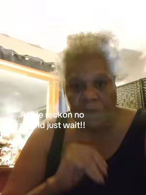 The cover image shows a close-up shot of an older woman with short curly hair, wearing a black top, against a blurry background with a window and curtains. Text overlay is visible.